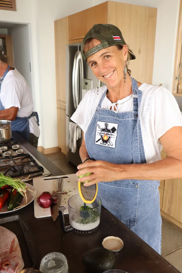 Diana, co-founder of Grill Master Tamarindo, cooking in the kitchen