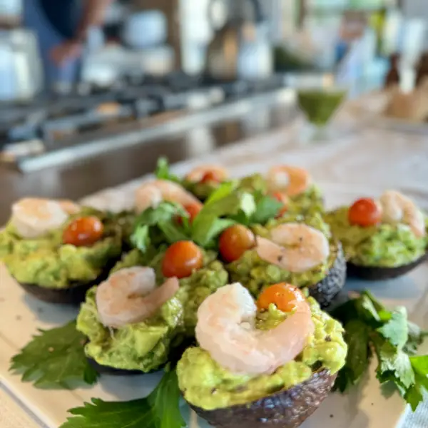 Shrimp and avocado appetizers plated for a private dinner