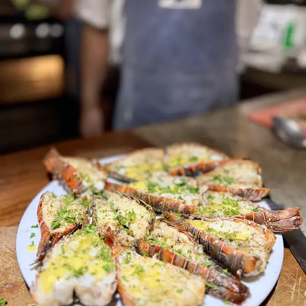 Grilled lobster tails with garlic butter and herbs