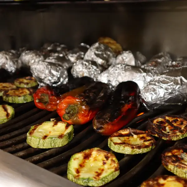 Grilled zucchini, peppers and foil-wrapped potatoes