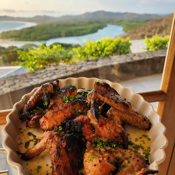 Grilled chicken with a view of the Tamarindo estuary