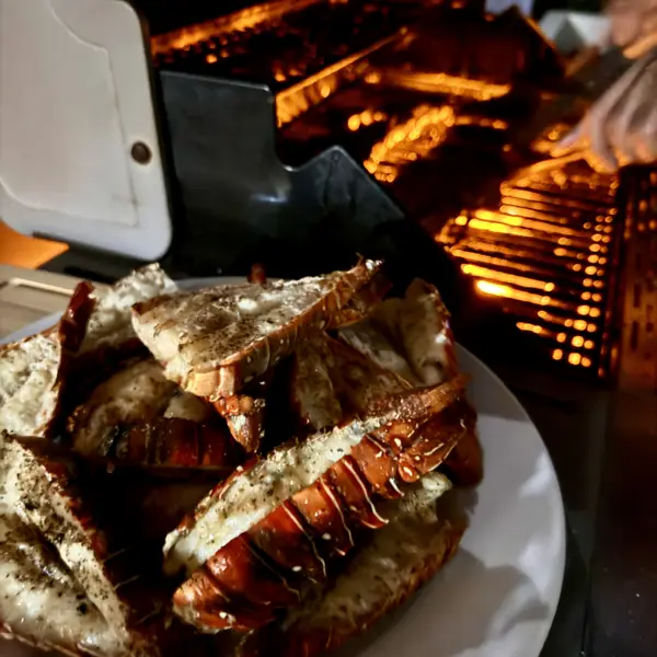 Grilled lobster next to the open-flame grill